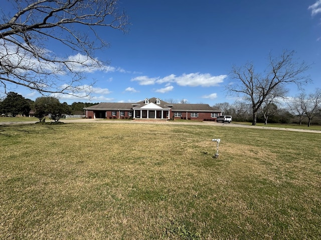 ranch-style house with a front yard