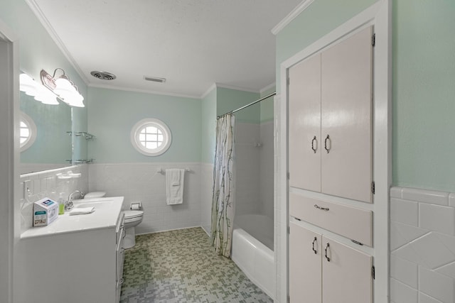 full bathroom featuring toilet, vanity, tile walls, and crown molding