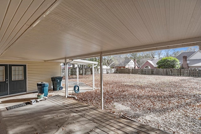 wooden deck with a patio area