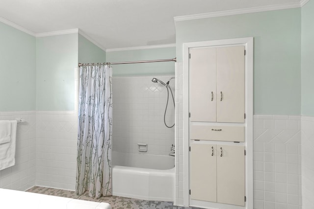 bathroom with tile walls, crown molding, and shower / bath combo