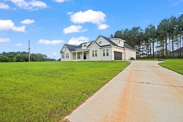 5700 S State Highway 605, Rehobeth, AL 36301 - modern farmhouse style home featuring driveway, a front lawn, stucco siding, an attached garage, and covered porch