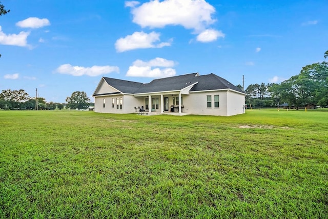 5700 S State Highway 605, Rehobeth, AL 36301 - back of property featuring a patio area, a lawn, and stucco siding