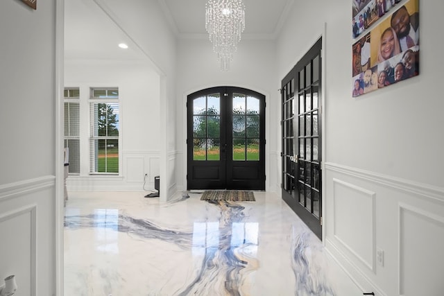 5700 S State Highway 605, Rehobeth, AL 36301 - foyer entrance with a decorative wall, french doors, a chandelier, ornamental molding, and a wainscoted wall