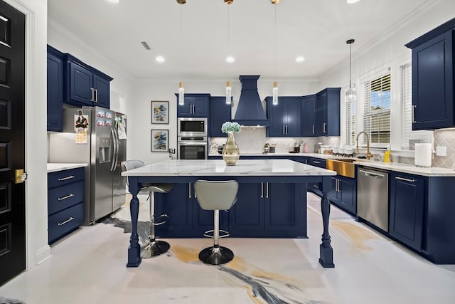 5700 S State Highway 605, Rehobeth, AL 36301 - kitchen with stainless steel appliances, blue cabinetry, premium range hood, a breakfast bar, and tasteful backsplash