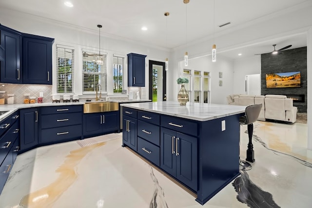 5700 S State Highway 605, Rehobeth, AL 36301 - kitchen with blue cabinetry, backsplash, a kitchen island, ornamental molding, and hanging light fixtures