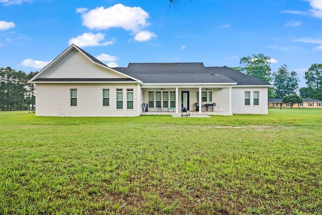 5700 S State Highway 605, Rehobeth, AL 36301 - rear view of house with a ceiling fan, a patio, a lawn, and roof with shingles