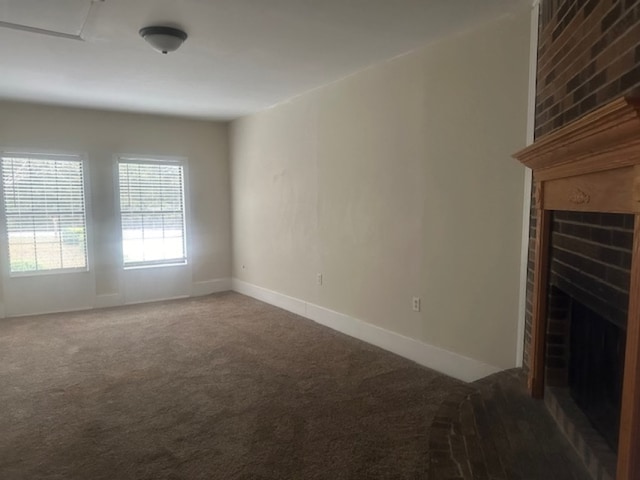 unfurnished living room featuring carpet and a fireplace