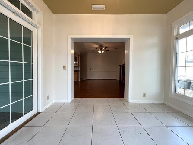 unfurnished room featuring ceiling fan