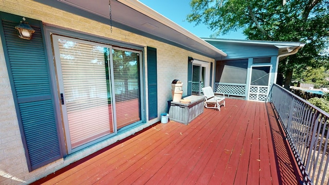 wooden terrace featuring a sunroom