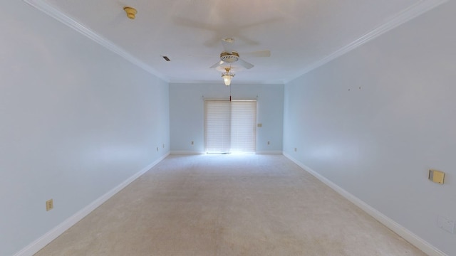 unfurnished room with ceiling fan, crown molding, and light carpet