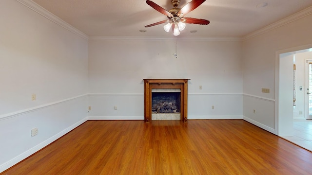 unfurnished living room featuring light wood-type flooring, ceiling fan, and ornamental molding