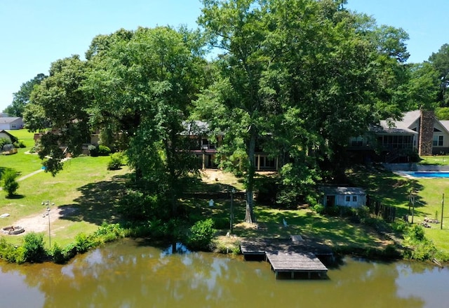 birds eye view of property featuring a water view