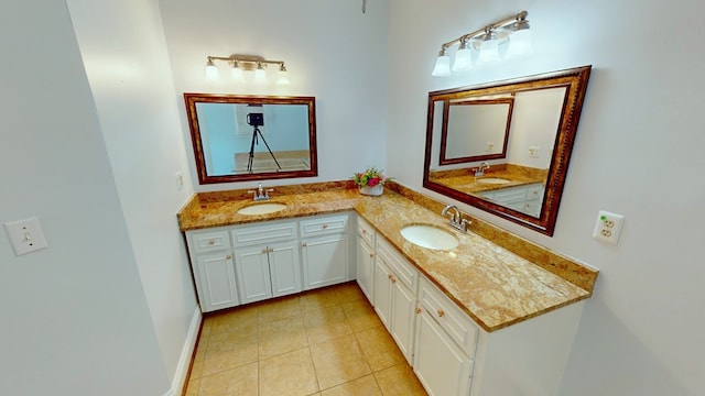 bathroom featuring tile patterned flooring and vanity