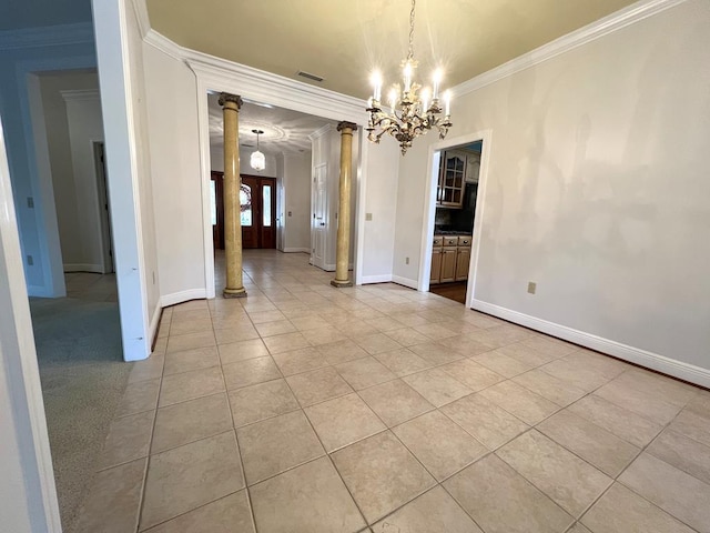 unfurnished dining area featuring a chandelier, light tile patterned floors, decorative columns, and crown molding