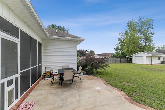 106 Lake Ln, Headland, AL 36345 - view of patio featuring outdoor dining area and an outbuilding