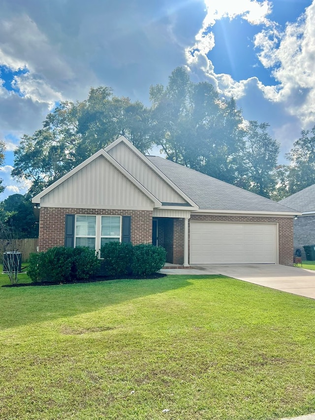 view of front of house featuring a front yard and a garage