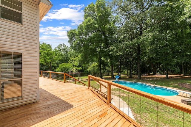 408 Shakespeare Dr, Dothan, AL 36303 - wooden deck with an outdoor pool, view of scattered trees, and a yard