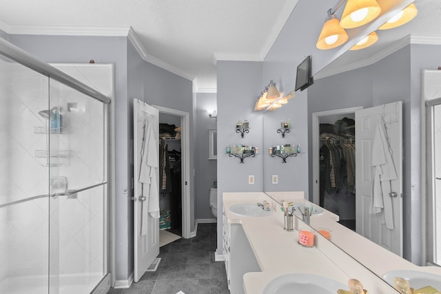 408 Shakespeare Dr, Dothan, AL 36303 - full bath featuring a stall shower, double vanity, tile patterned flooring, a spacious closet, and crown molding