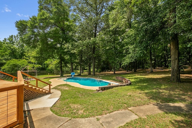 408 Shakespeare Dr, Dothan, AL 36303 - swimming pool with a yard, a wooden deck, and view of scattered trees