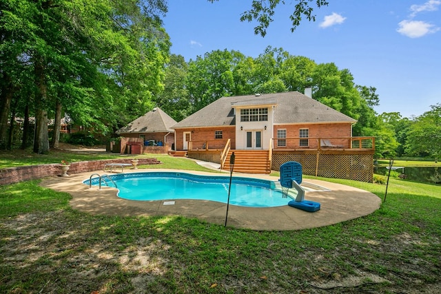 408 Shakespeare Dr, Dothan, AL 36303 - outdoor pool with a wooden deck, a lawn, french doors, and a patio