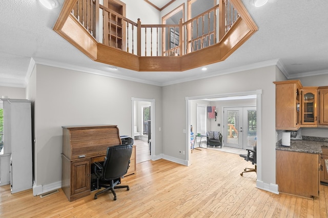 408 Shakespeare Dr, Dothan, AL 36303 - office featuring light wood-type flooring, plenty of natural light, baseboards, crown molding, and french doors