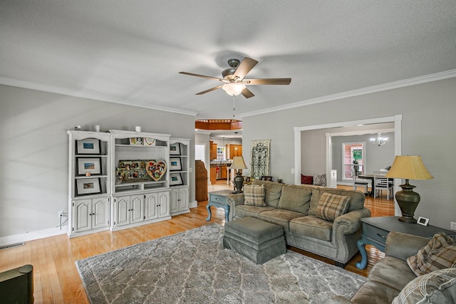 408 Shakespeare Dr, Dothan, AL 36303 - living area with a ceiling fan, a chandelier, crown molding, light wood-style flooring, and baseboards