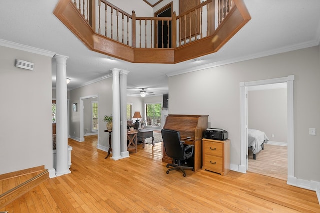 408 Shakespeare Dr, Dothan, AL 36303 - office featuring decorative columns, light wood finished floors, crown molding, ceiling fan, and baseboards