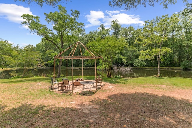 408 Shakespeare Dr, Dothan, AL 36303 - view of grassy yard with a gazebo, an outdoor fire pit, a water view, and a forest view