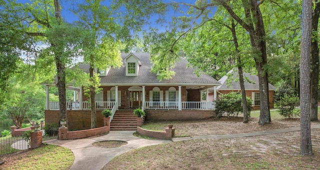 408 Shakespeare Dr, Dothan, AL 36303 - cape cod house with covered porch, brick siding, stairway, and roof with shingles