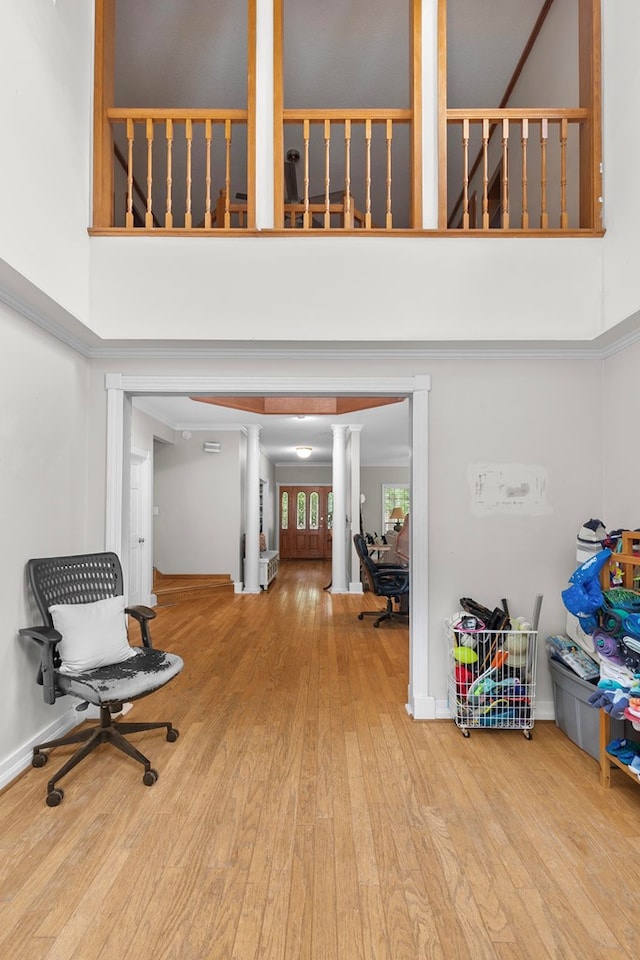 408 Shakespeare Dr, Dothan, AL 36303 - hall featuring wood finished floors, a towering ceiling, and ornate columns