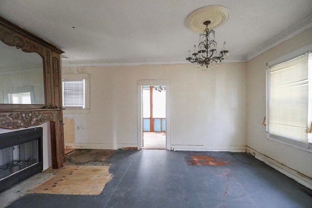 unfurnished living room featuring a notable chandelier, crown molding, a healthy amount of sunlight, and concrete floors