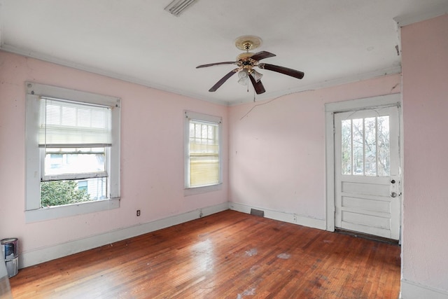 foyer entrance featuring ceiling fan, crown molding, and dark hardwood / wood-style flooring