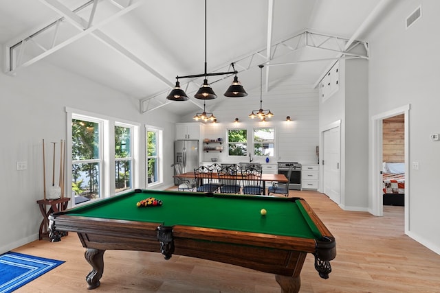 rec room with sink, light hardwood / wood-style floors, high vaulted ceiling, and billiards