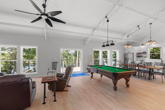 game room with ceiling fan, light hardwood / wood-style floors, billiards, and a wealth of natural light