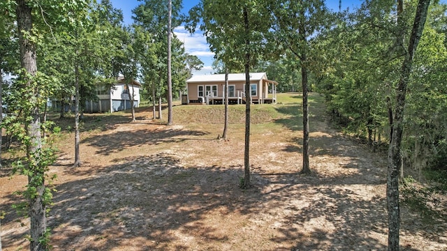 view of yard with a wooden deck