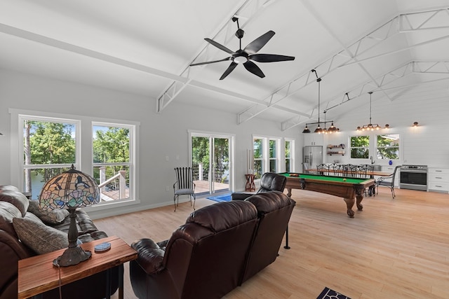 interior space featuring vaulted ceiling with beams, plenty of natural light, light hardwood / wood-style floors, and billiards