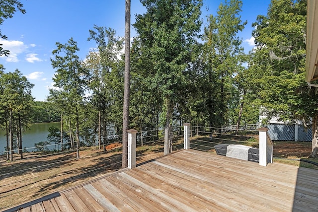 wooden deck with a water view