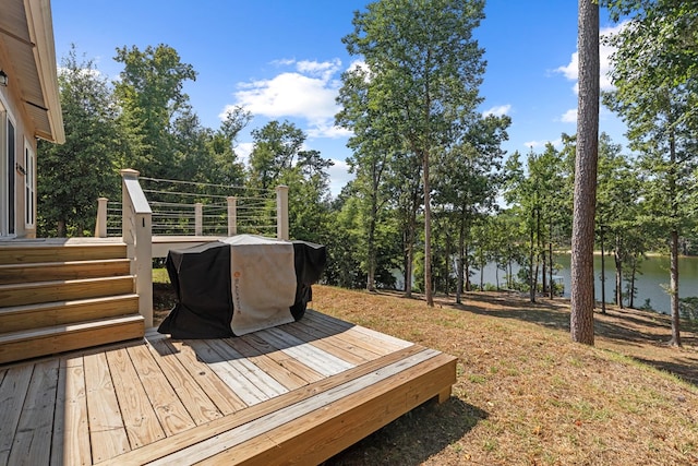 wooden deck with a water view