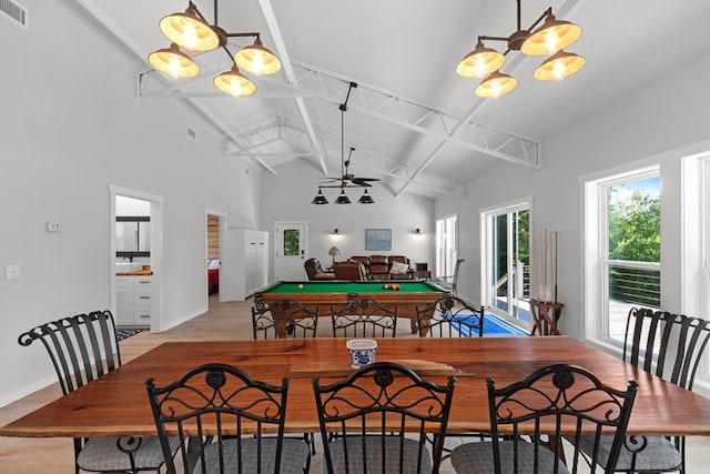 dining area featuring high vaulted ceiling, ceiling fan with notable chandelier, light wood-type flooring, pool table, and beamed ceiling