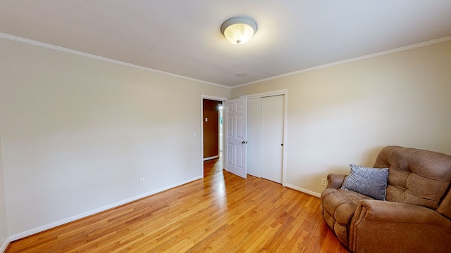 unfurnished room featuring crown molding and light hardwood / wood-style flooring