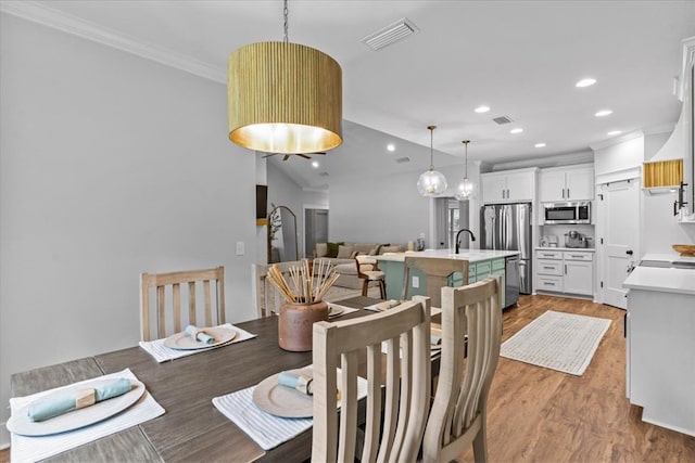 246 Suggs Rd, Dothan, AL 36345 - dining space featuring ornamental molding, wood finished floors, and recessed lighting