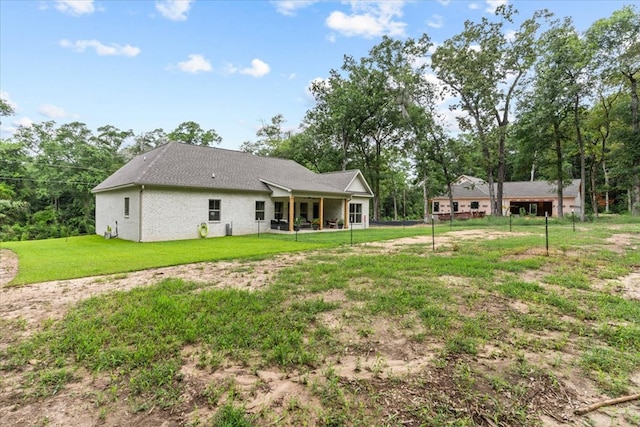 246 Suggs Rd, Dothan, AL 36345 - rear view of house featuring a lawn
