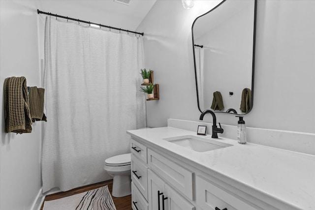 246 Suggs Rd, Dothan, AL 36345 - bathroom with vanity, wood finished floors, and curtained shower