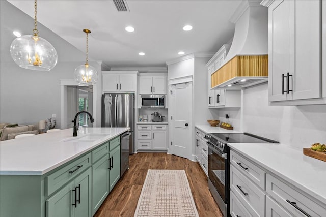 246 Suggs Rd, Dothan, AL 36345 - kitchen featuring appliances with stainless steel finishes, green cabinetry, custom exhaust hood, light countertops, and white cabinets
