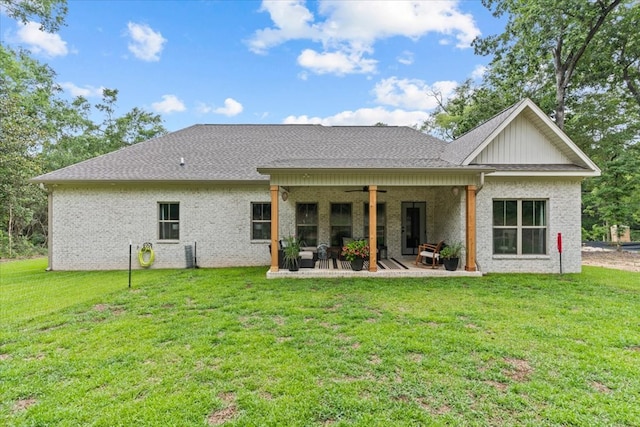 246 Suggs Rd, Dothan, AL 36345 - rear view of property with a ceiling fan, a patio, a lawn, and board and batten siding