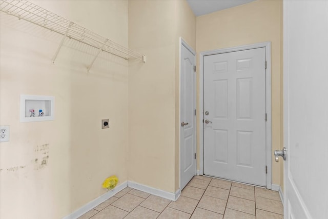 laundry room with light tile patterned floors, hookup for a washing machine, and hookup for an electric dryer