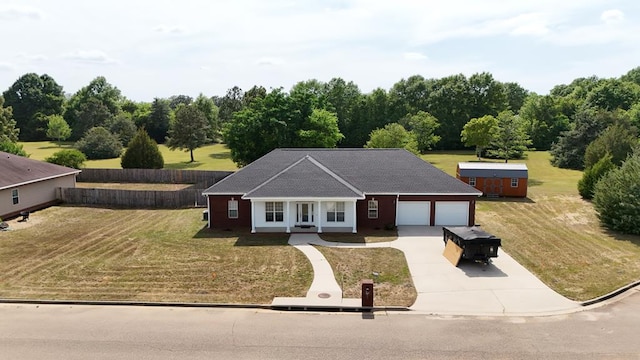 209 David Hussey Rd, Newton, AL 36352 - ranch-style home with concrete driveway, a front yard, a garage, and covered porch