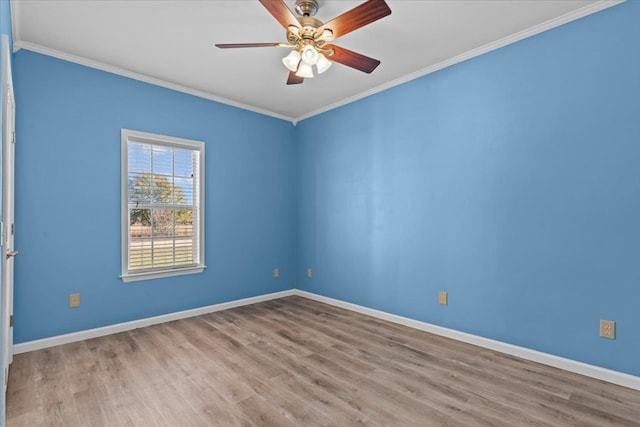 unfurnished room featuring ornamental molding, ceiling fan, and light wood-type flooring