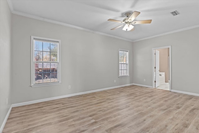 empty room featuring ornamental molding, ceiling fan, and light wood-type flooring