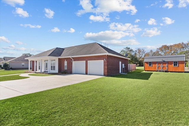 ranch-style home featuring a storage unit, a front lawn, and a garage